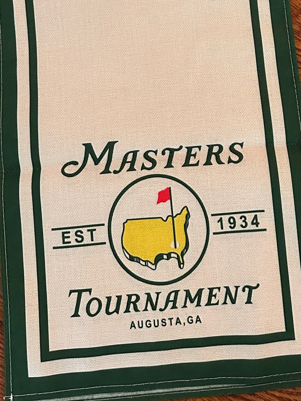 Masters Cream Table Runner with Green Trim and Yellow Emblem